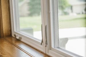 Wood framed windowsill with vinyl windows.