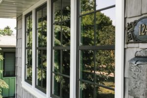 A row of windows shown from the outside of a home