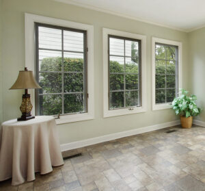 Covered porch in suburban home with windows and door to patio